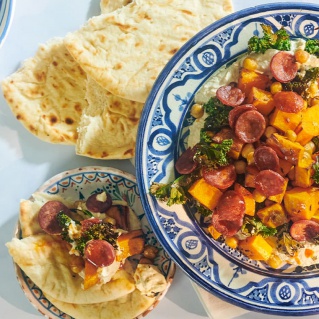 Houmous bowl with chorizo and crispy kale