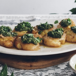 Oven-baked smashed potatoes with green pesto